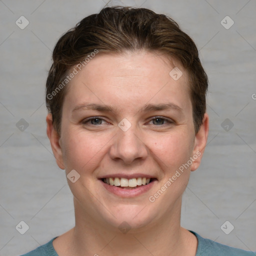 Joyful white young-adult female with short  brown hair and grey eyes