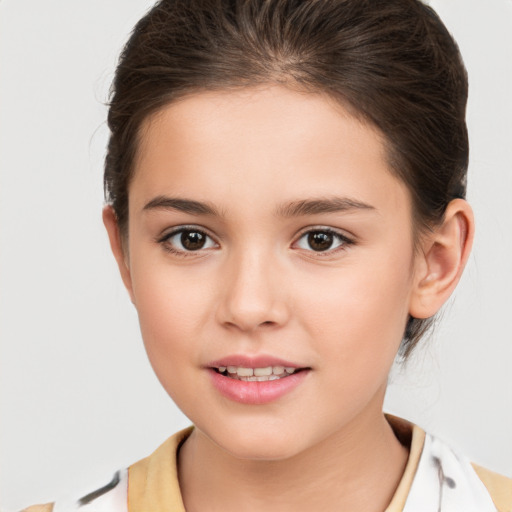 Joyful white child female with short  brown hair and brown eyes