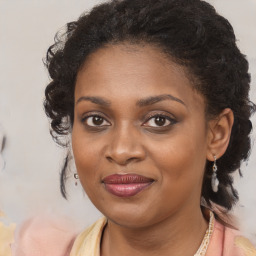 Joyful black young-adult female with long  brown hair and brown eyes