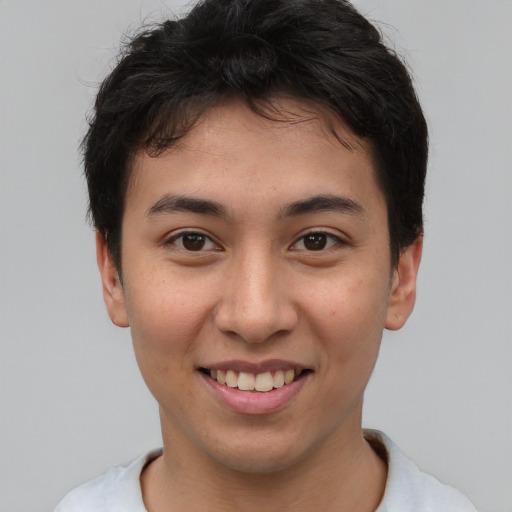 Joyful asian young-adult female with short  brown hair and brown eyes