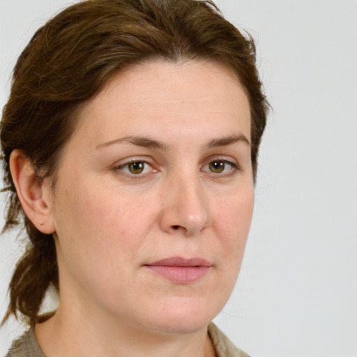 Joyful white young-adult female with medium  brown hair and green eyes