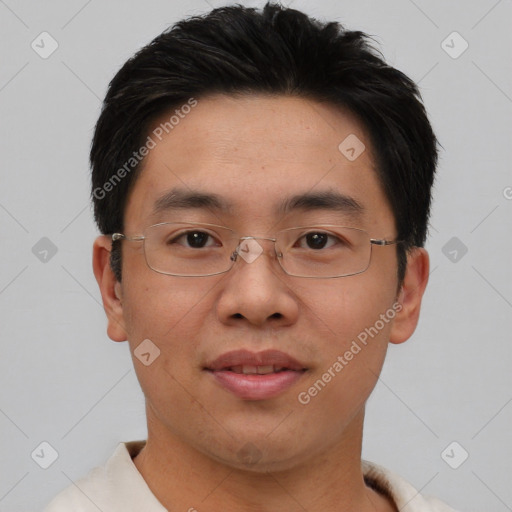 Joyful asian young-adult male with short  brown hair and brown eyes