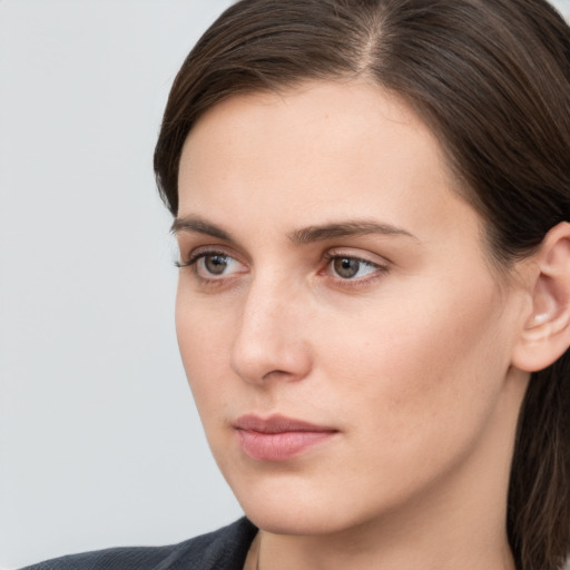 Neutral white young-adult female with medium  brown hair and grey eyes