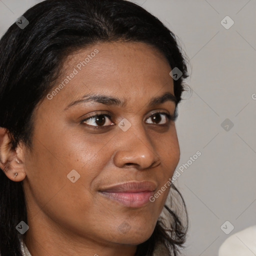 Joyful black young-adult female with long  brown hair and brown eyes