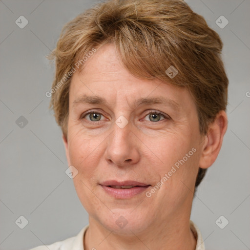 Joyful white adult female with short  brown hair and grey eyes