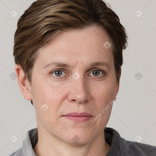 Joyful white adult female with short  brown hair and grey eyes