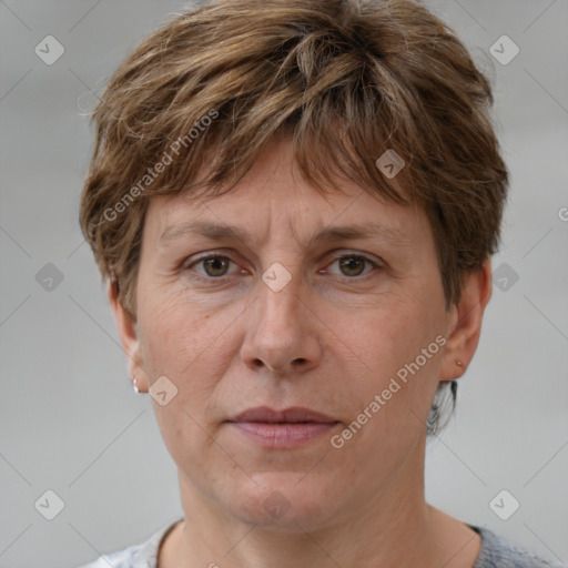 Joyful white adult male with short  brown hair and grey eyes