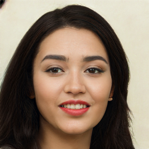 Joyful white young-adult female with long  black hair and brown eyes