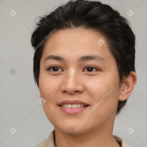 Joyful asian young-adult female with short  brown hair and brown eyes