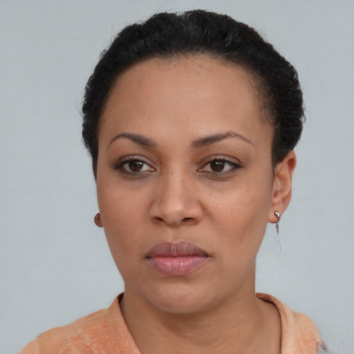 Neutral black young-adult female with short  black hair and brown eyes