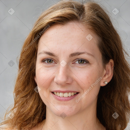 Joyful white young-adult female with long  brown hair and green eyes