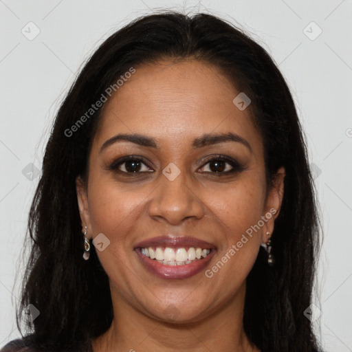 Joyful black young-adult female with long  brown hair and brown eyes