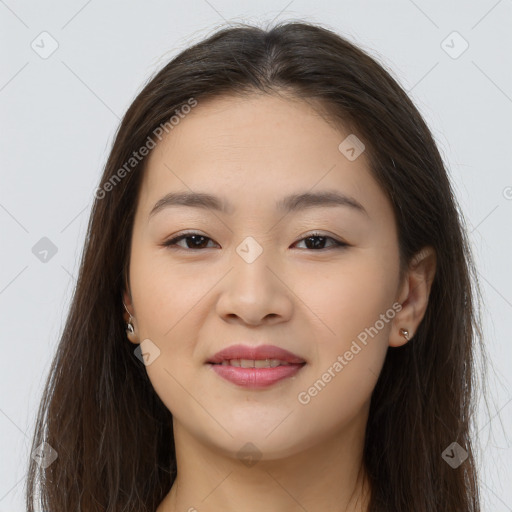 Joyful asian young-adult female with long  brown hair and brown eyes