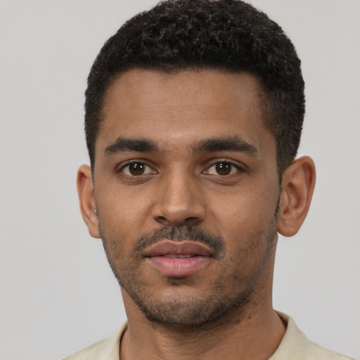 Neutral black young-adult male with short  black hair and brown eyes