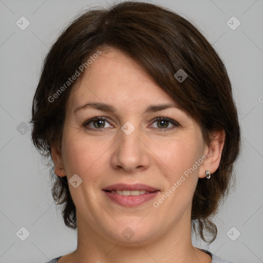 Joyful white adult female with medium  brown hair and grey eyes