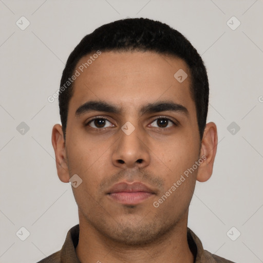 Neutral latino young-adult male with short  black hair and brown eyes