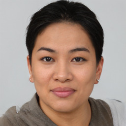 Joyful asian young-adult female with short  brown hair and brown eyes