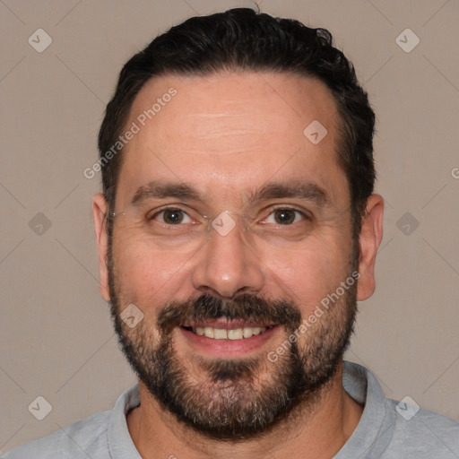 Joyful white adult male with short  black hair and brown eyes