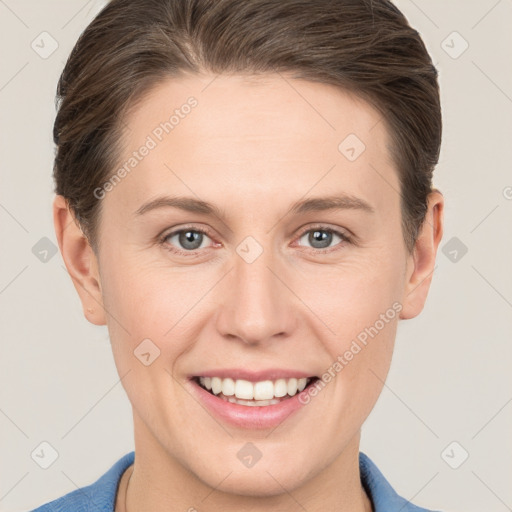 Joyful white young-adult female with short  brown hair and grey eyes