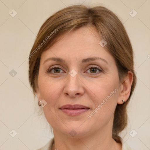 Joyful white adult female with medium  brown hair and grey eyes