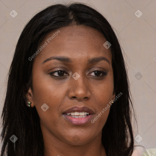 Joyful black young-adult female with long  brown hair and brown eyes