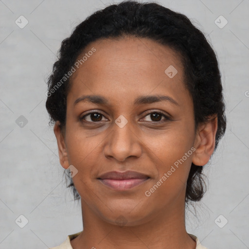 Joyful latino young-adult female with medium  black hair and brown eyes