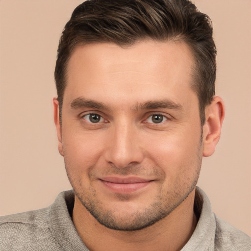 Joyful white young-adult male with short  brown hair and brown eyes