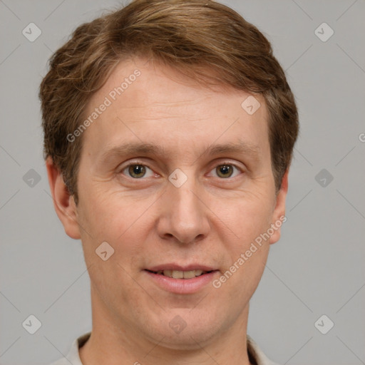 Joyful white adult male with short  brown hair and grey eyes