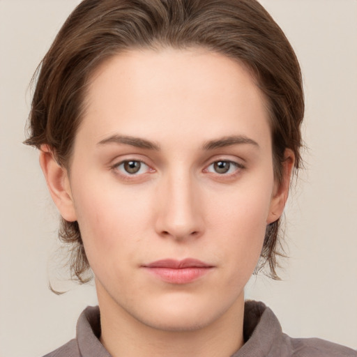 Neutral white young-adult female with medium  brown hair and grey eyes