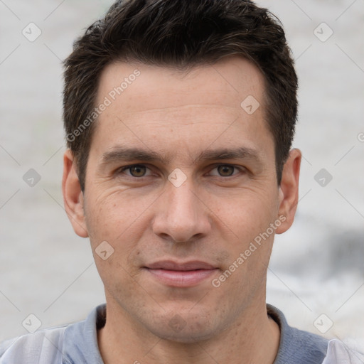 Joyful white adult male with short  brown hair and brown eyes