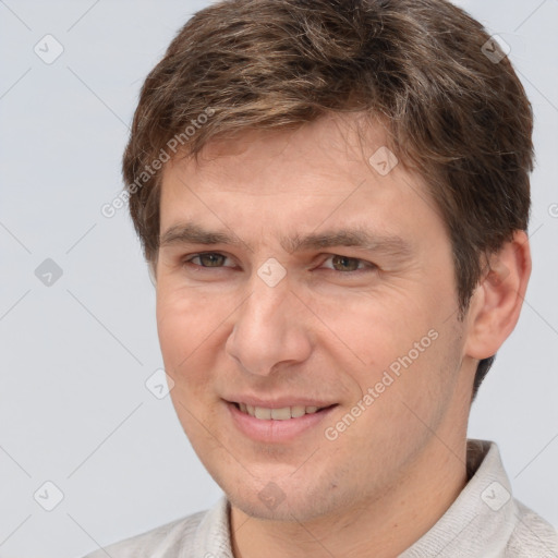 Joyful white adult male with short  brown hair and brown eyes