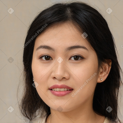 Joyful asian young-adult female with medium  brown hair and brown eyes