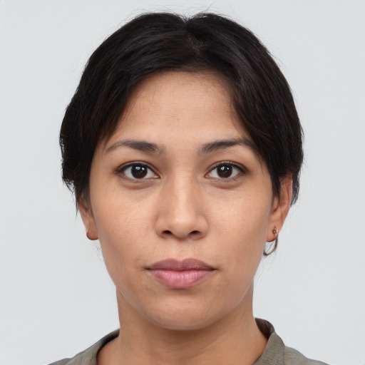 Neutral white young-adult female with short  brown hair and brown eyes