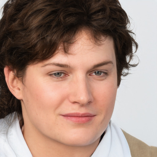 Joyful white young-adult male with medium  brown hair and brown eyes