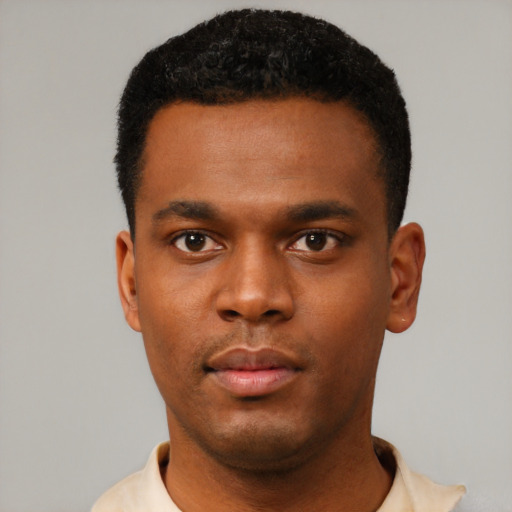 Neutral black young-adult male with short  black hair and brown eyes
