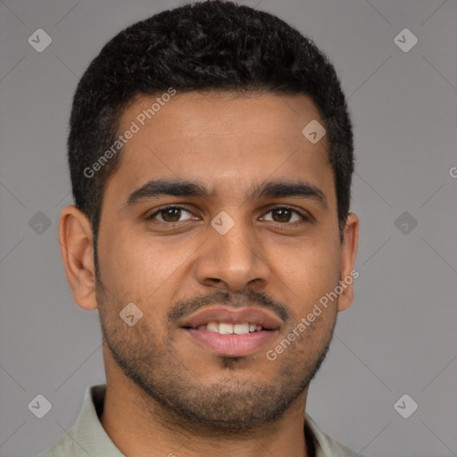 Joyful latino young-adult male with short  brown hair and brown eyes