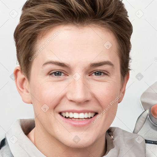 Joyful white young-adult female with short  brown hair and grey eyes