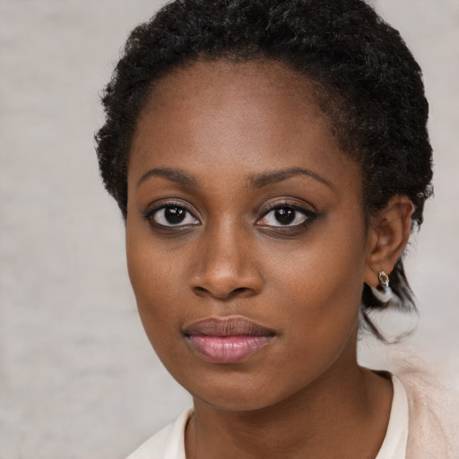 Neutral black young-adult female with short  brown hair and brown eyes