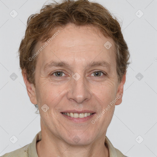 Joyful white adult male with short  brown hair and grey eyes