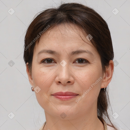 Joyful white adult female with medium  brown hair and brown eyes