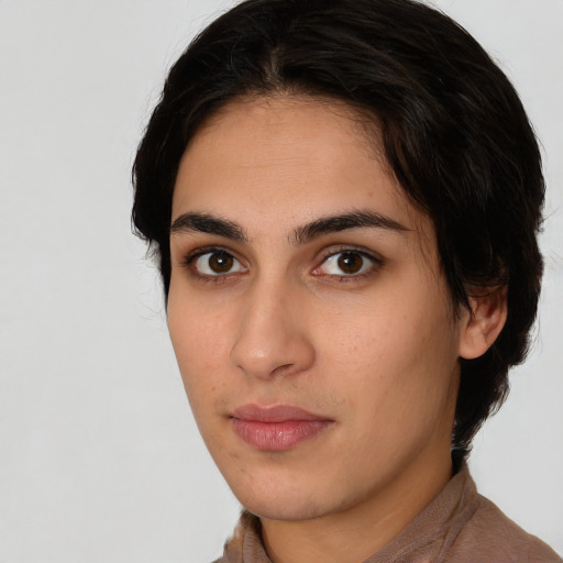 Neutral white young-adult female with short  brown hair and brown eyes