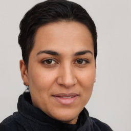 Joyful latino young-adult female with short  brown hair and brown eyes