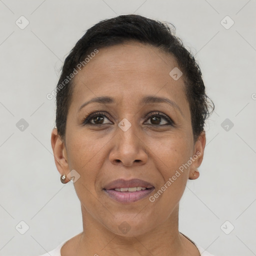 Joyful latino adult female with short  brown hair and brown eyes