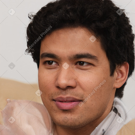 Joyful latino young-adult male with short  brown hair and brown eyes