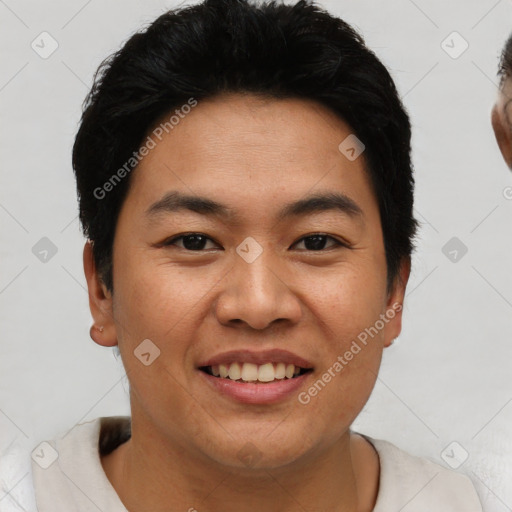 Joyful asian young-adult male with short  brown hair and brown eyes