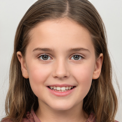 Joyful white child female with long  brown hair and brown eyes