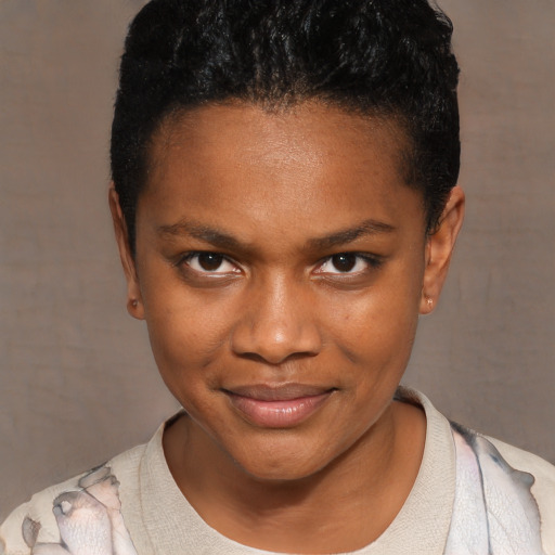 Joyful black young-adult female with short  black hair and brown eyes