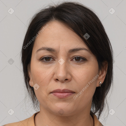 Joyful white adult female with medium  brown hair and brown eyes