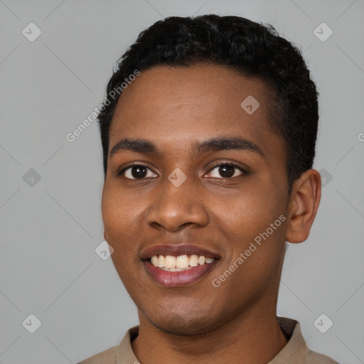 Joyful black young-adult male with short  black hair and brown eyes