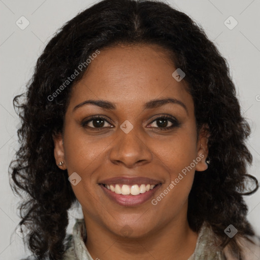 Joyful black young-adult female with medium  brown hair and brown eyes